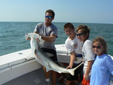 Kids shark fishing with Bald head island fishing charters